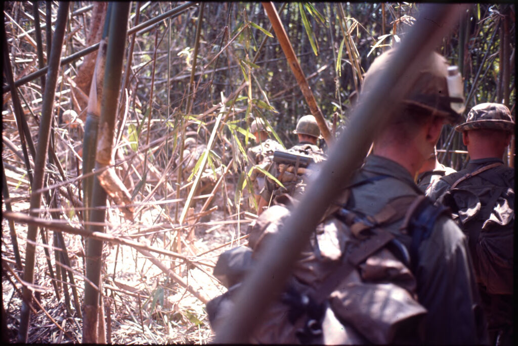 Untitled (Soldiers In Combat Gear Hiking Through Jungle, Central Highlands Near Dak To, Vietnam)