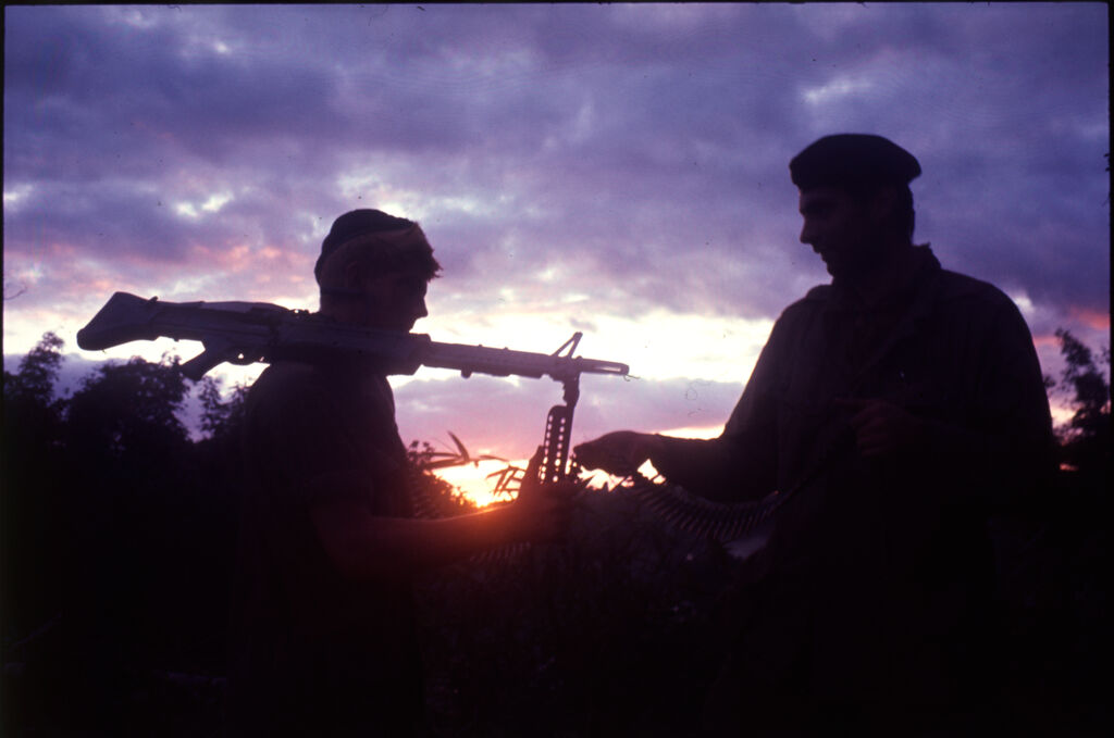 Untitled (Soldiers Silhouetted Against Setting Sun And Clouds, Vietnam)