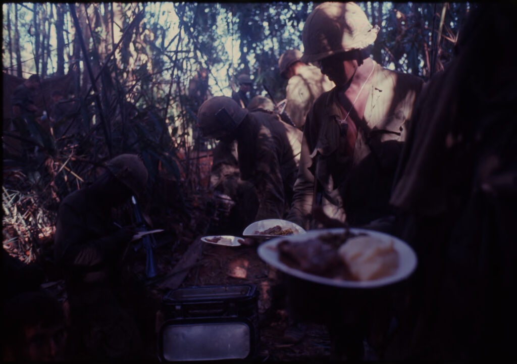 Untitled (Soldiers In Jungle Getting Food, Central Highlands Near Dak To, Vietnam)
