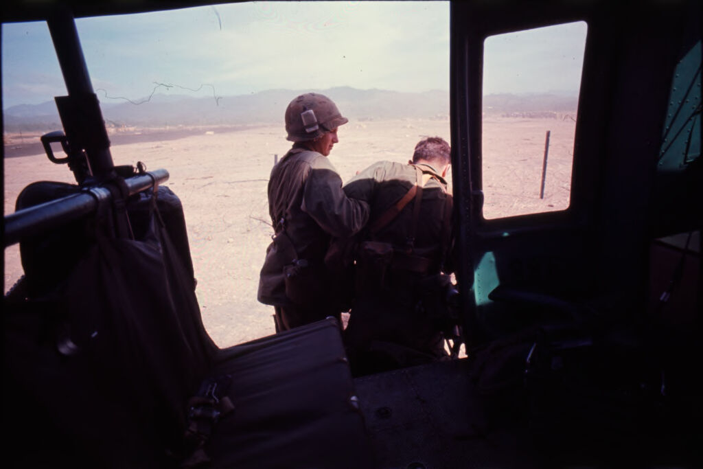 Untitled (Soldiers Climbing Out Of Helicopter, Outside Central Highlands, Vietnam)