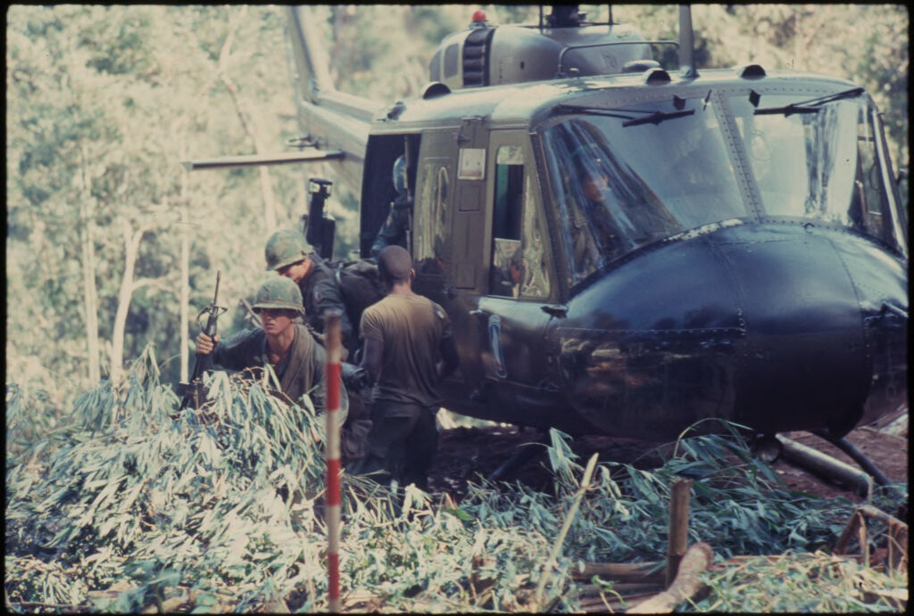 Untitled (Soldiers Exiting Helicopter In Jungle Of Central Highlands Near Dak To, Vietnam)