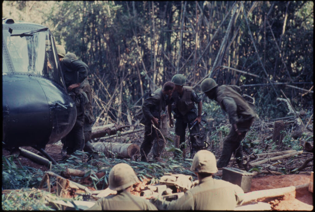 Untitled (Soldiers Exiting Helicopter In Jungle Of Central Highlands Near Dak To, Vietnam)