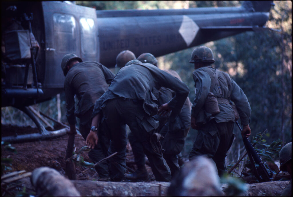 Untitled (Soldiers Boarding Helicopter Following Battle For Hill 882, Central Highlands Near Dak To, Vietnam)