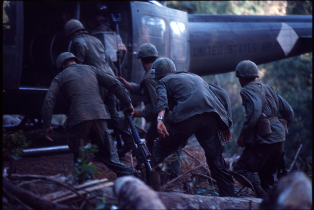 Untitled (Soldiers Boarding Helicopter Following Battle For Hill 882, Central Highlands Near Dak To, Vietnam)