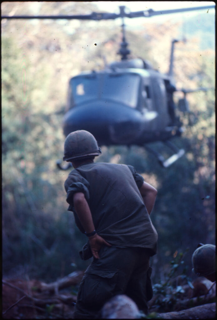 Untitled (Soldiers In Clearing Near Top Of Hill 882 Watching Arrival Of Helicopter, Central Highlands Near Dak To, Vietnam)