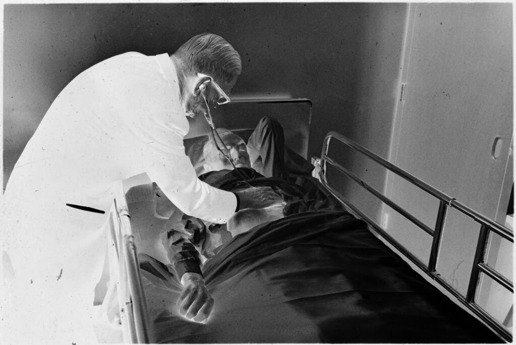 Untitled (Dr. Herman M. Juergens Checking On Patient In Hospital Bed)