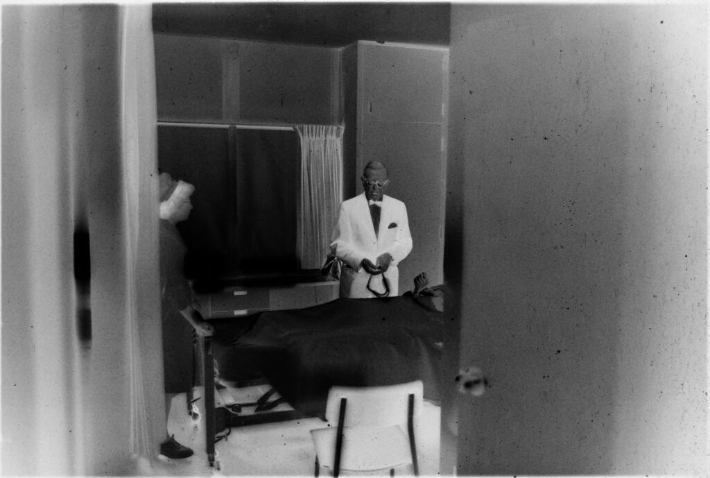 Untitled (Dr. Herman M. Juergens Standing By Bedside In Patient's Room)