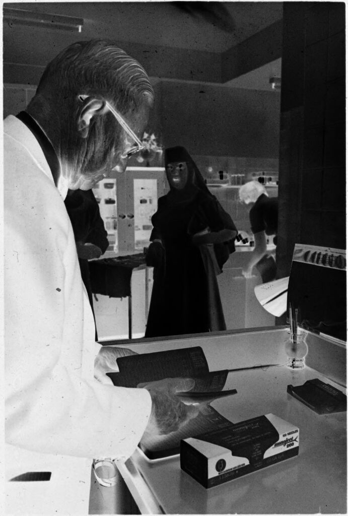 Untitled (Dr. Herman M. Juergens And Nun In Office)