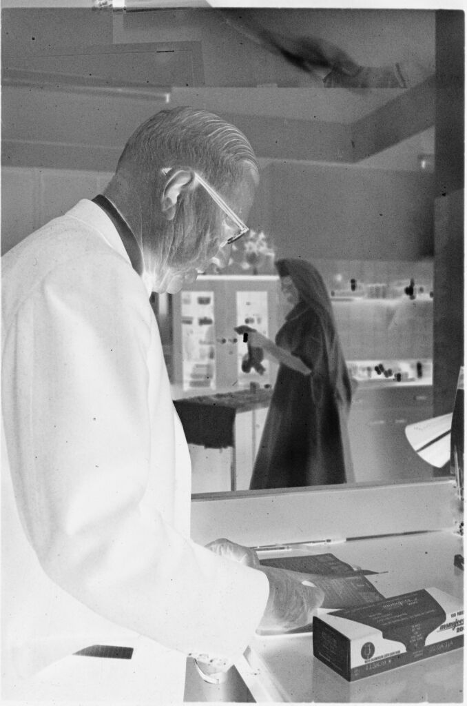 Untitled (Dr. Herman M. Juergens And Nun In Work Area)
