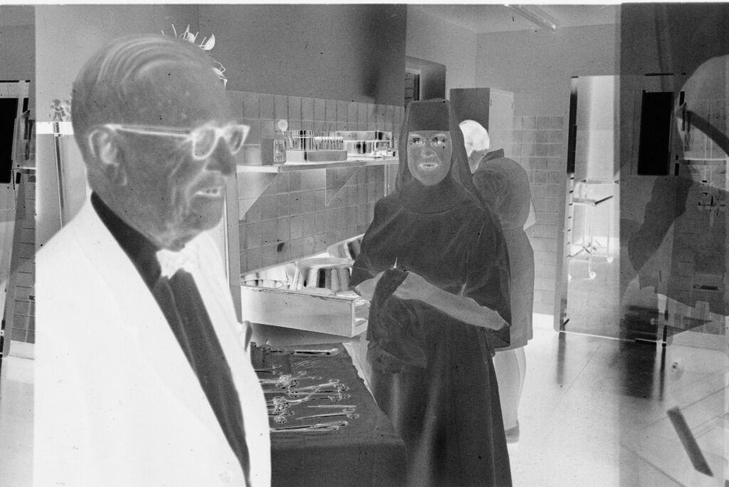 Untitled (Dr. Herman M. Juergens And Nun In Work Area)