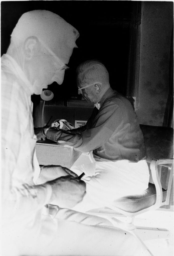 Untitled (Dr. Herman M. Juergens Talking With Patient)