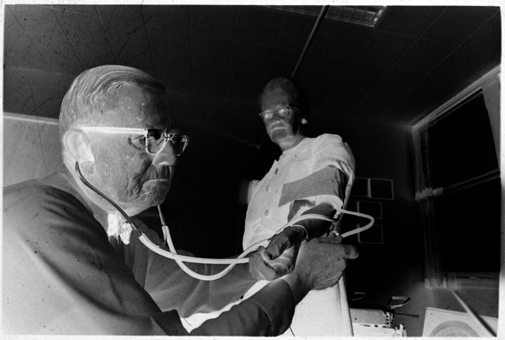Untitled (Dr. Herman M. Juergens Checking Patient's Blood Pressure)