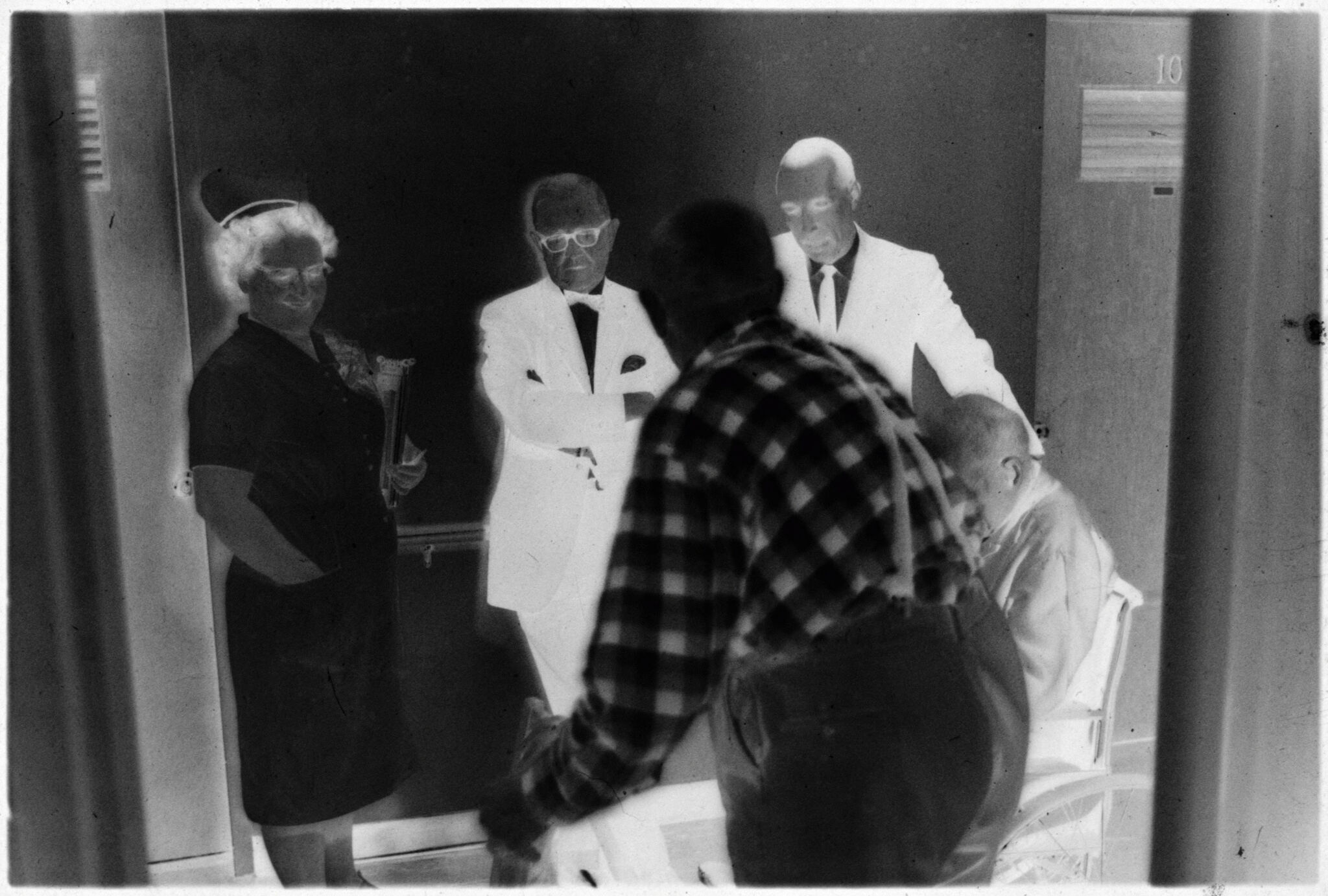 Untitled (Two Doctors, Nurse, And Two Patients Talking In Hallway)