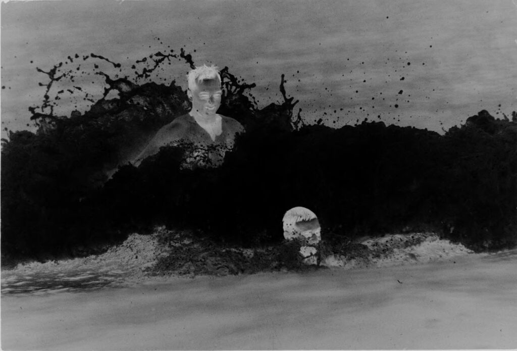Untitled (Two Men Jumping Waves In The Ocean, Vietnam)