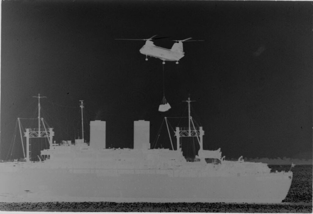 Untitled (Large Ship At Sea With Army Helicopter Hovering Overhead, Vietnam)