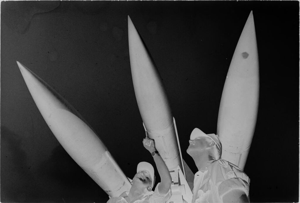 Untitled (Worm's-Eye View Of Soldiers Standing Under Hawk Missiles, Nha Trang Harbor, Vietnam)