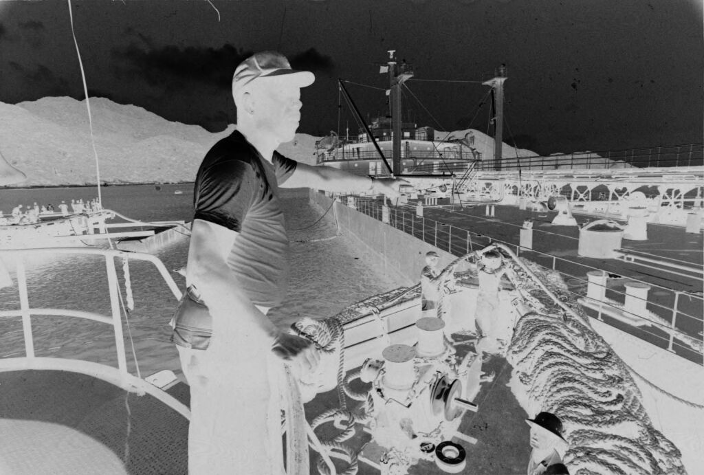 Untitled (Soldier Looking Over Deck Of Ship, Vietnam)