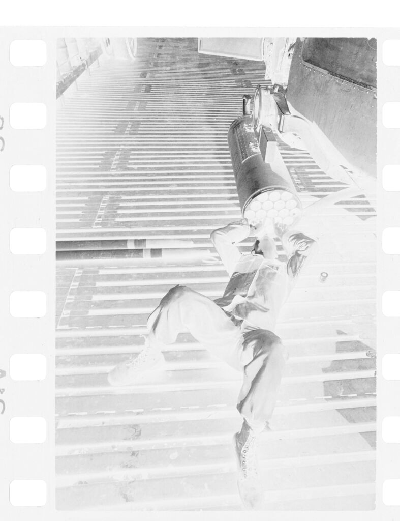 Untitled (Soldier Lying On Back Looking Into Tube, Vietnam)