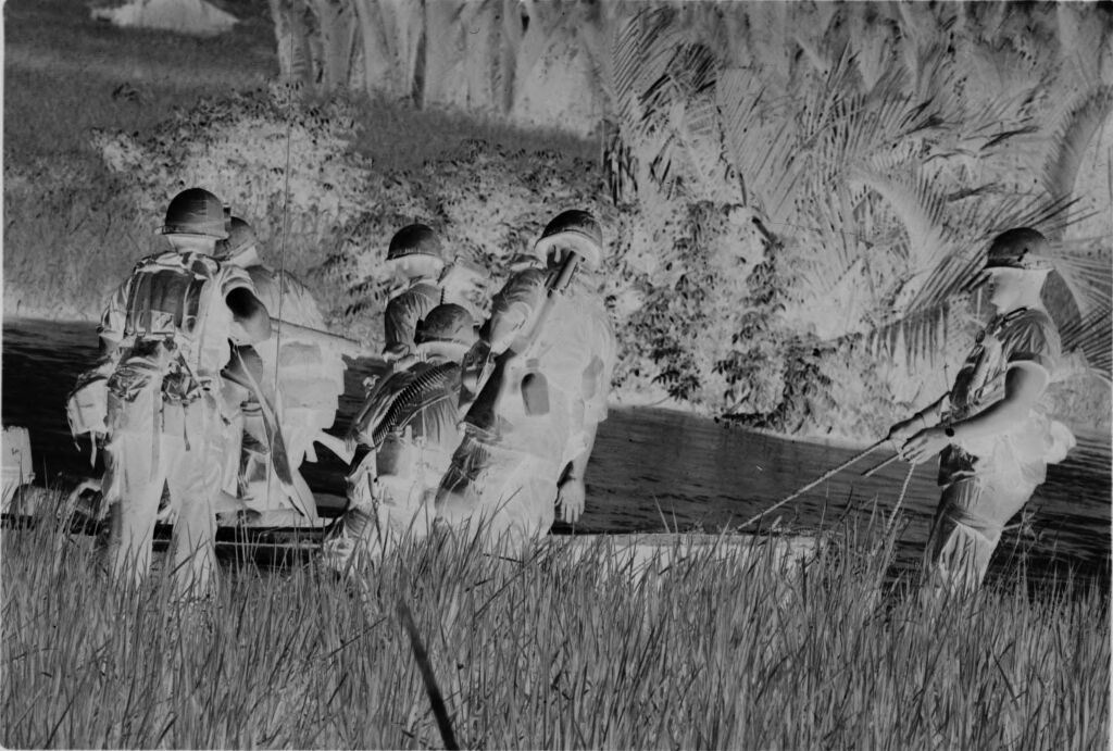 Untitled (Soldiers Carrying Supplies And Equipment Into River, Vietnam)