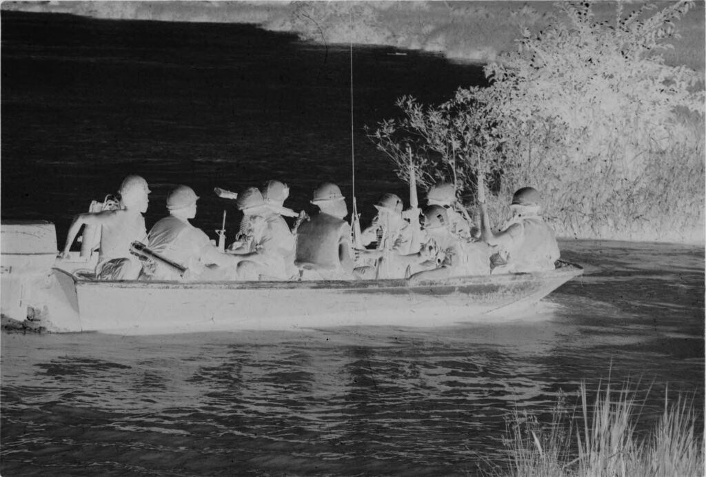 Untitled (Soldiers In Boat On River, Vietnam)