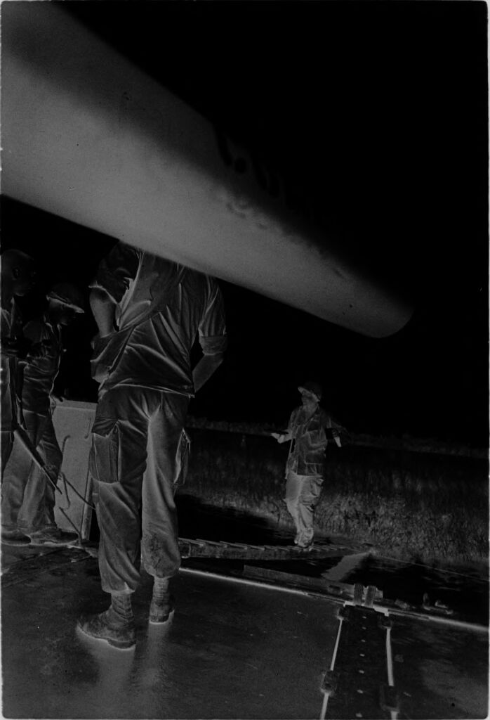 Untitled (Soldier Walking Across Plank From Marsh To Landing Craft, Mobile Riverine Force, Mekong Delta, Vietnam)
