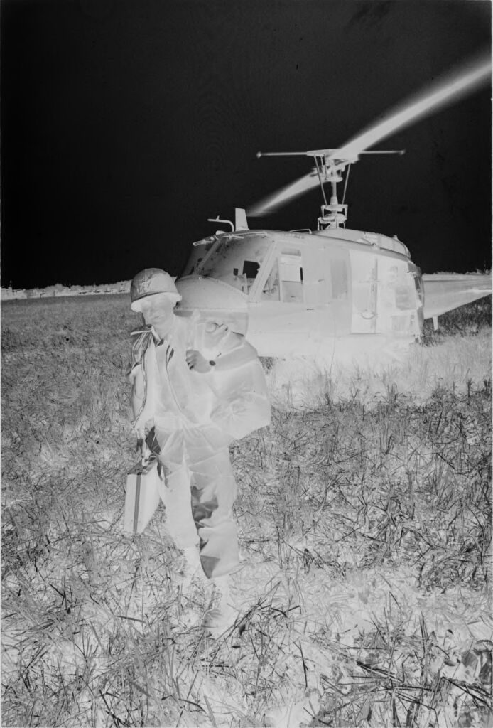 Untitled (Soldier In Field In Front Of Helicopter, Vietnam)