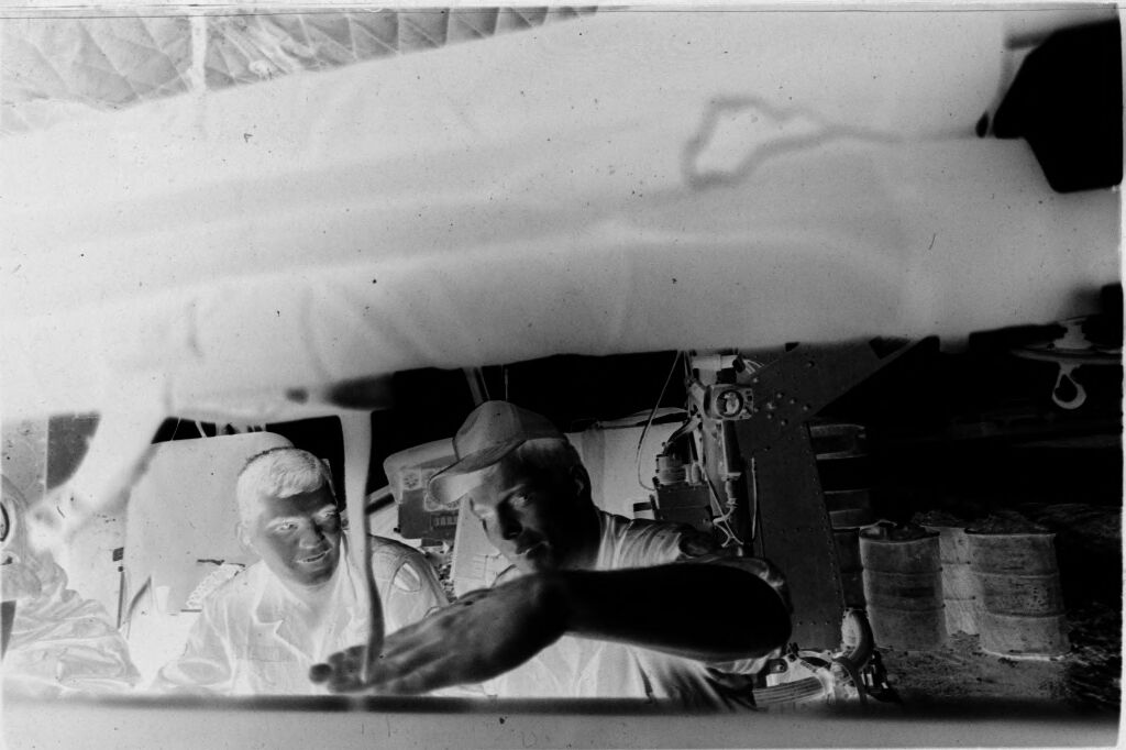 Untitled (Medevac Team Seated Inside Grounded Helicopter, Vietnam)