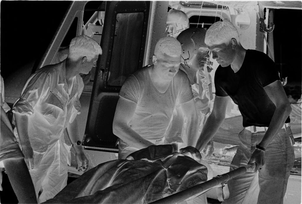 Untitled (Members Of 57Th Medical Detachment Unloading Stretcher From Medevac Helicopter, Vietnam)