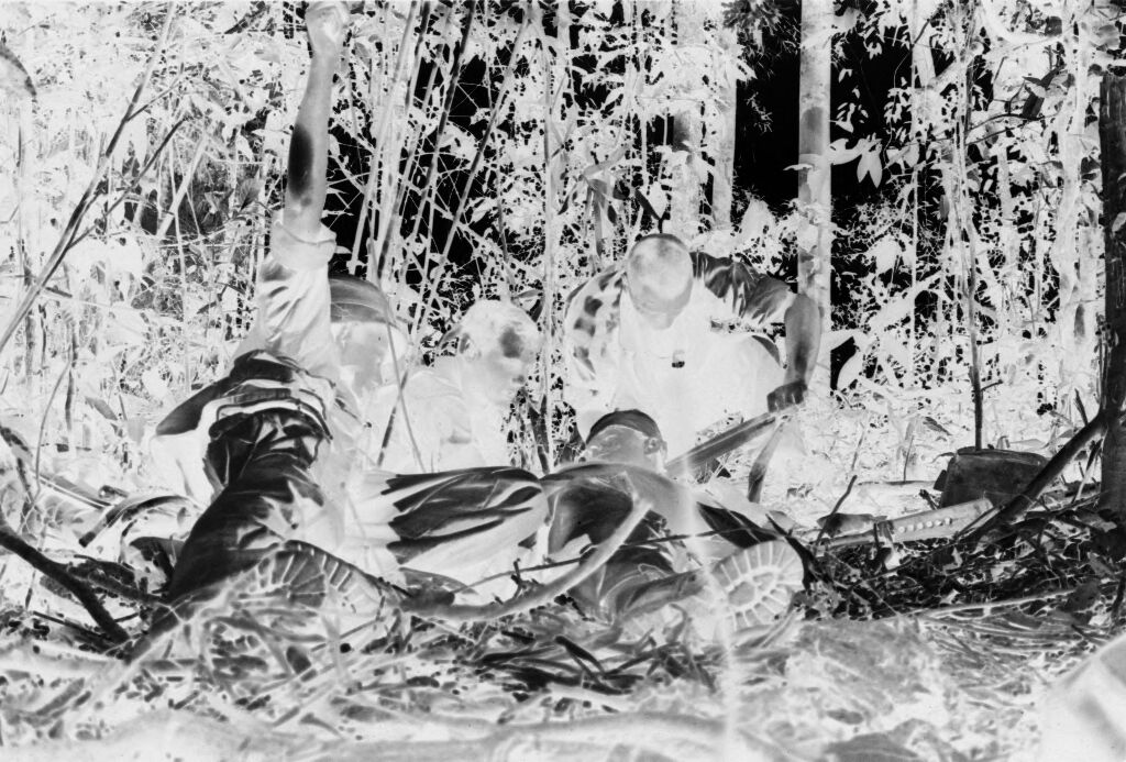Untitled (Soldiers Providing Emergency Treatment For Member Of Unit Wounded During Fighting In Central Highlands Near Dak To, Vietnam)
