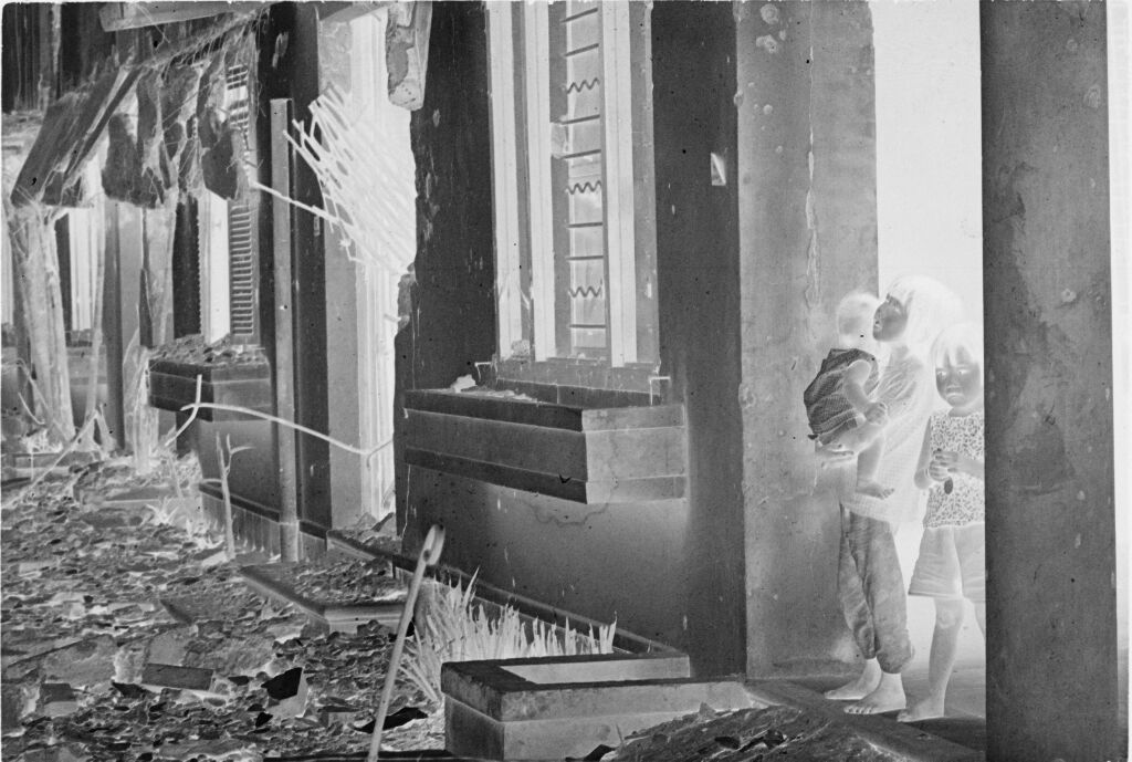 Untitled (Three Children Standing In A Doorway Of Damaged Building, Hue, Vietnam)