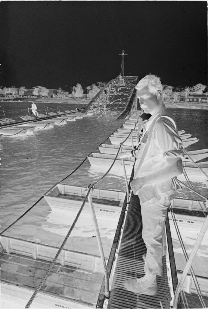 Untitled (Soldier Standing On Makeshift Span Of Partially Collapsed Bridge, Perfume River, Hue, Vietnam)