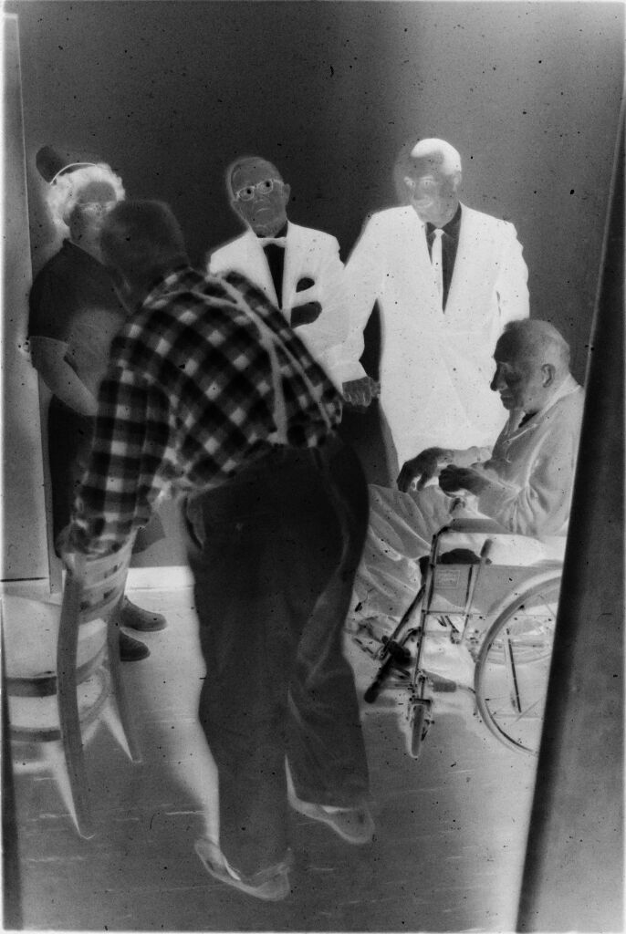 Untitled (Two Doctors, Nurse, And Two Patients Talking In Hallway)