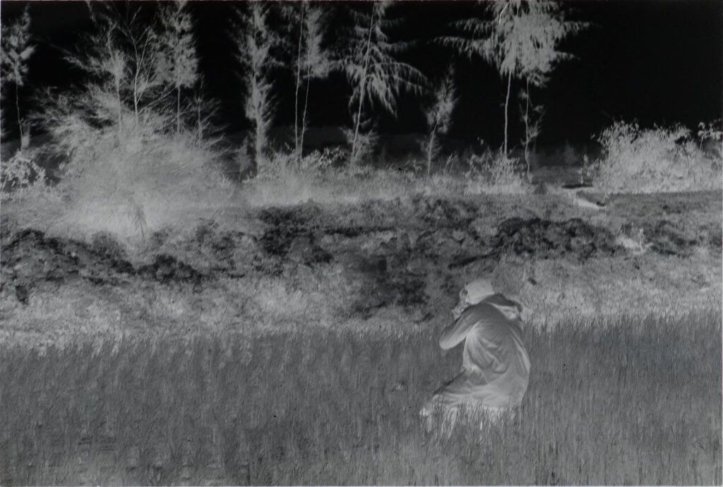 Untitled (Soldier Crouched In Rice Paddy Aiming Weapon, Vietnam)