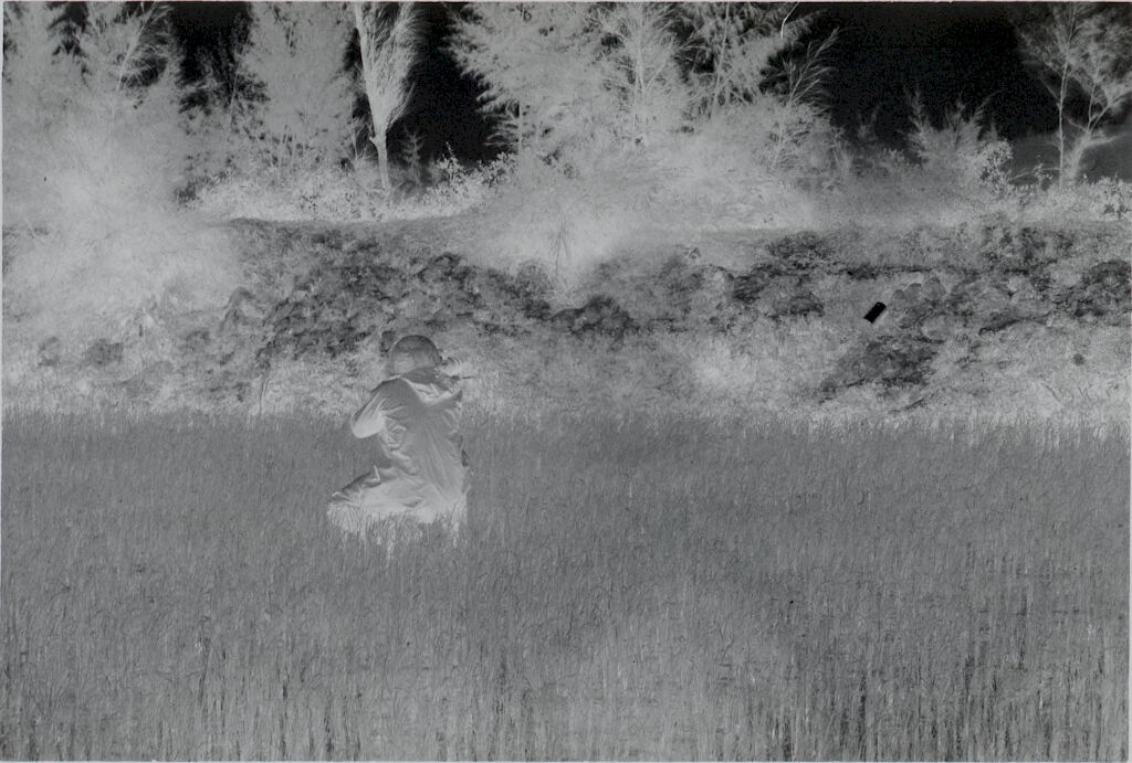 Untitled (Soldier Crouched In Rice Paddy Aiming Weapon, Vietnam)