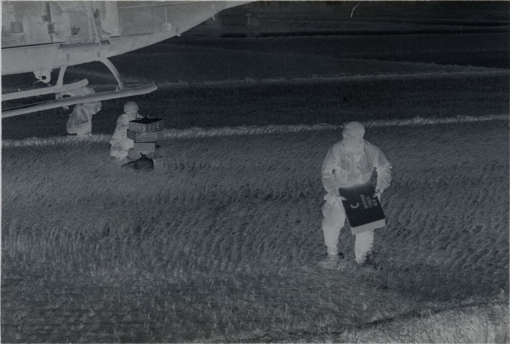 Untitled (Soldiers In Rice Paddy Carrying Supplies From Helicopter, Vietnam)