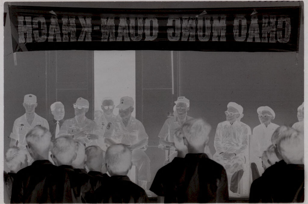 Untitled (Vietnamese Officials And U.s. Army Officers Seated Beneath Banner Reading 