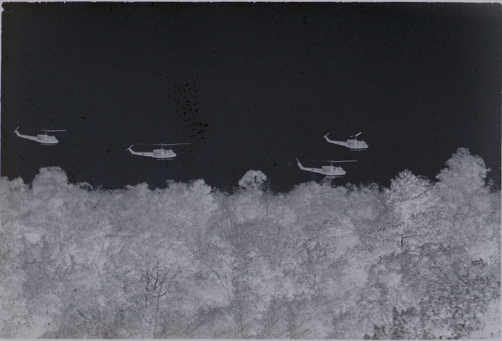 Untitled (Four Helicopters Flying Over Jungle, Vietnam)