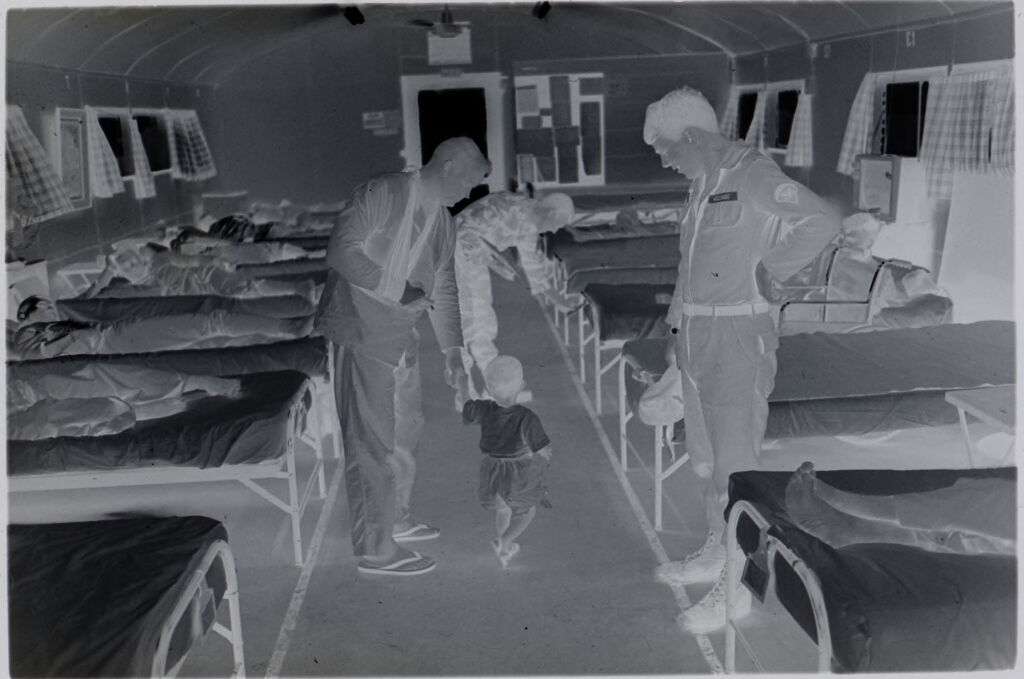 Untitled (Recovering Soldiers In Hospital Ward Playing With Vietnamese Child, Vietnam)