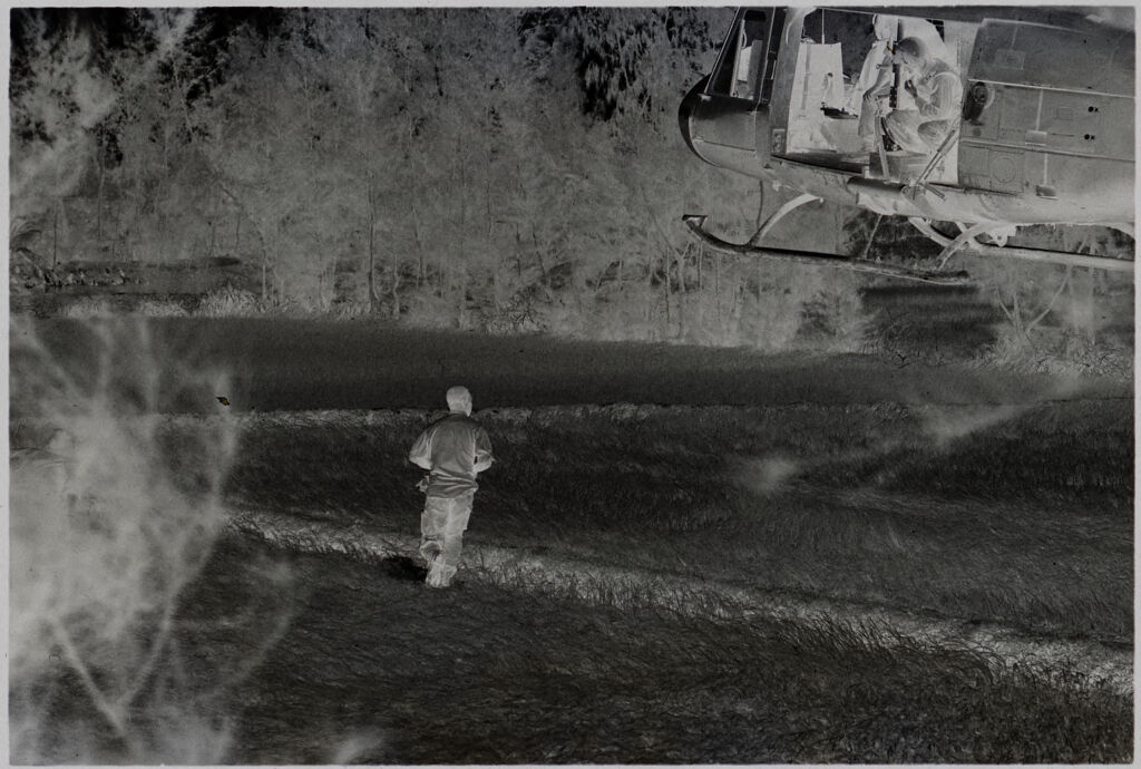 Untitled (Soldiers Directing Arrival Of Helicopter In Field, Vietnam)