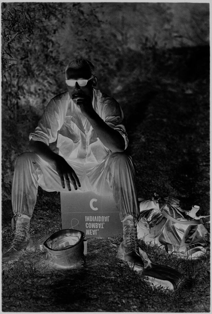Untitled (Soldier Seated On Overturned Box, Smoking A Cigarette, Vietnam)