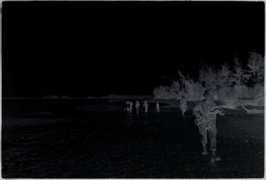 Untitled (Soldiers Walking Across Field, Vietnam)