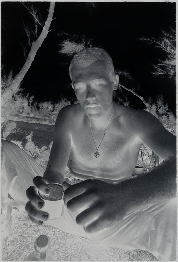 Untitled (Soldier Opening A Can Of Rations, Vietnam)