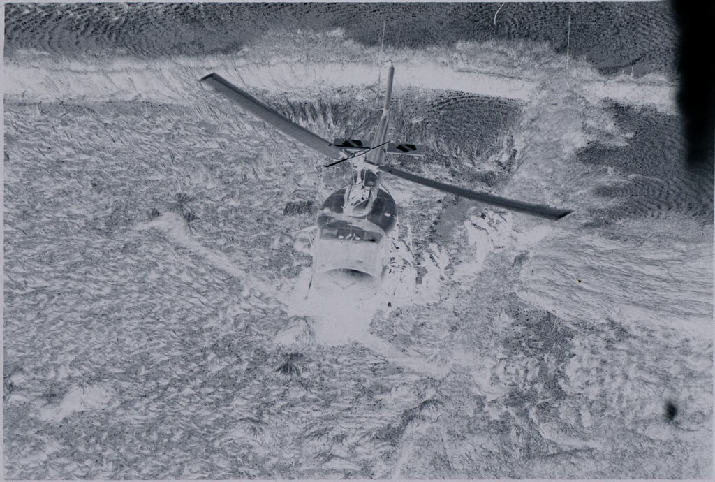 Untitled (Aerial View Of Helicopter Touching Down In Field, Vietnam)
