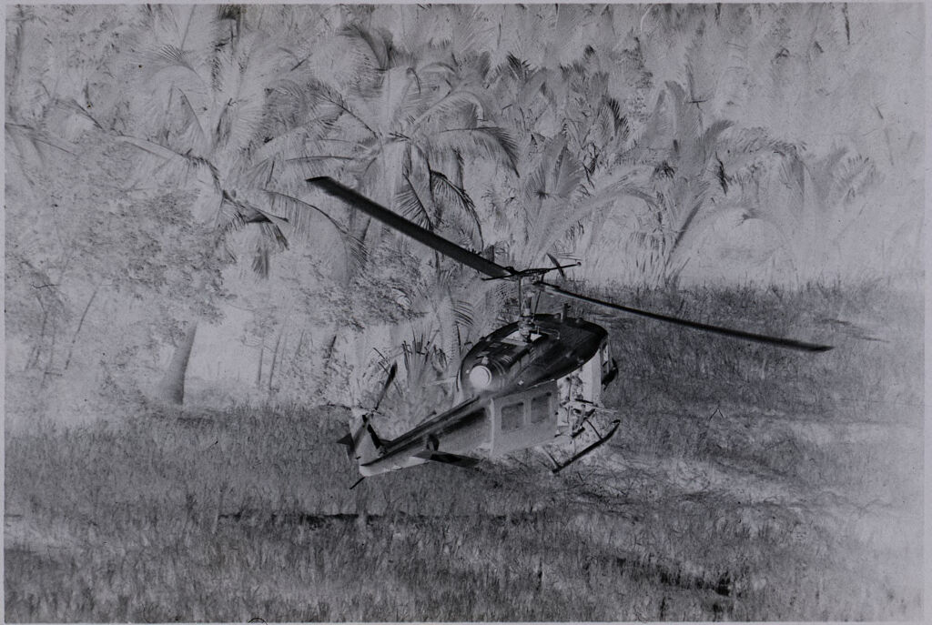 Untitled (Aerial View Of Helicopter Flying Over Field, Vietnam)