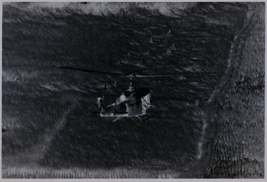 Untitled (Aerial View Of Helicopter Flying Over Field, Vietnam)