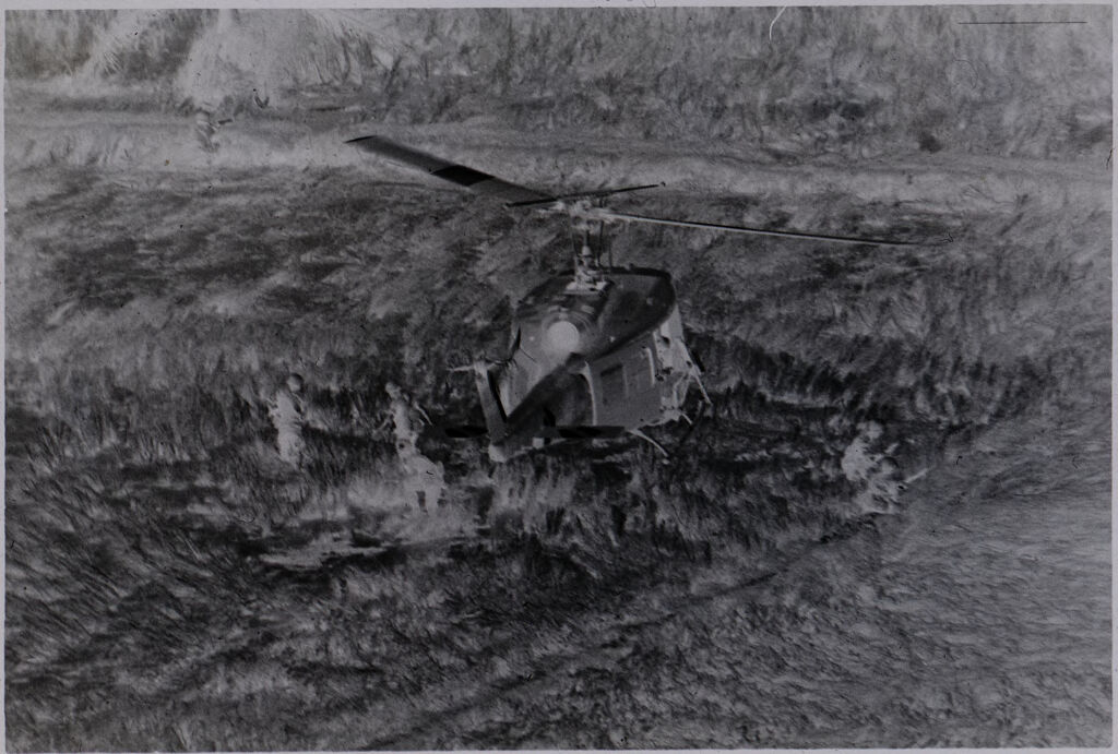 Untitled (Aerial View Of Helicopter Landing In Field And Soldiers Disembarking, Vietnam)