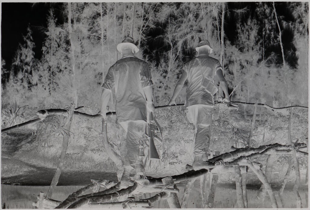 Untitled (Soldiers Crossing Bridge Made Of Tree Branches, Vietnam)