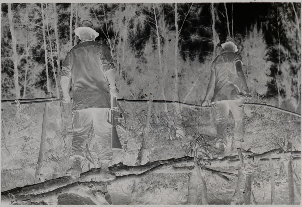 Untitled (Soldiers Crossing Bridge Made Of Tree Limbs, Vietnam)