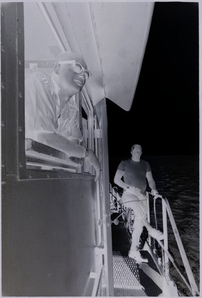 Untitled (Soldier Leaning Against Railing On Ship Deck And Soldier Leaning Out Window Above Deck, Vietnam)