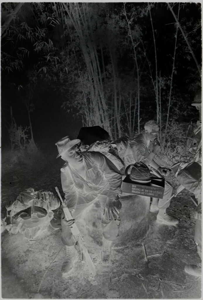 Untitled (Soldiers Sitting On Large Cylinder Resting, Vietnam)